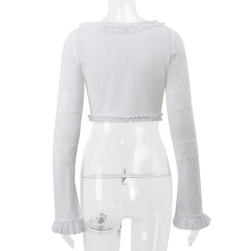 Ensemble élégant 2 pièces : haut à nouer sur le devant et mini jupe à volants superposés, pour un look chic et tendance.